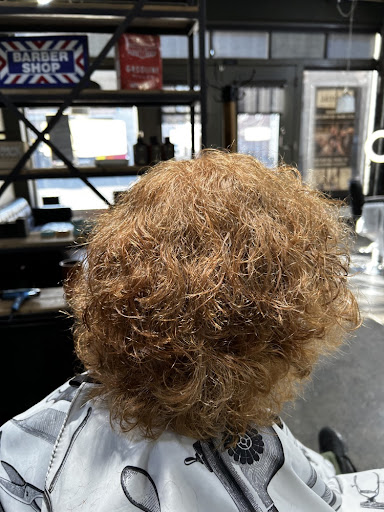 Curly hair styled and cut by professional cosmetologist at LifeStyle Barber