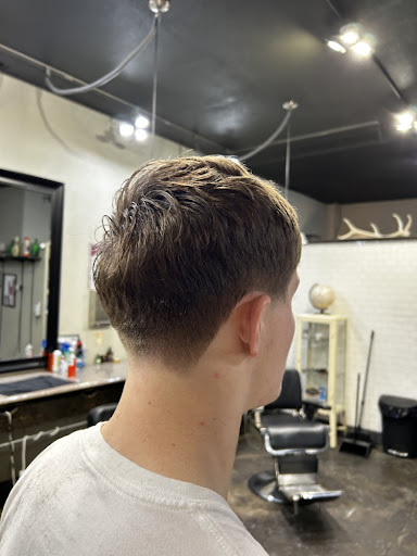 Clean low taper fade haircut side view